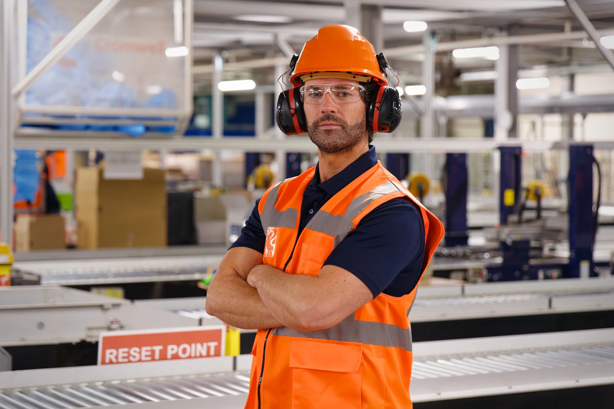 Industrial photography man orange PPE