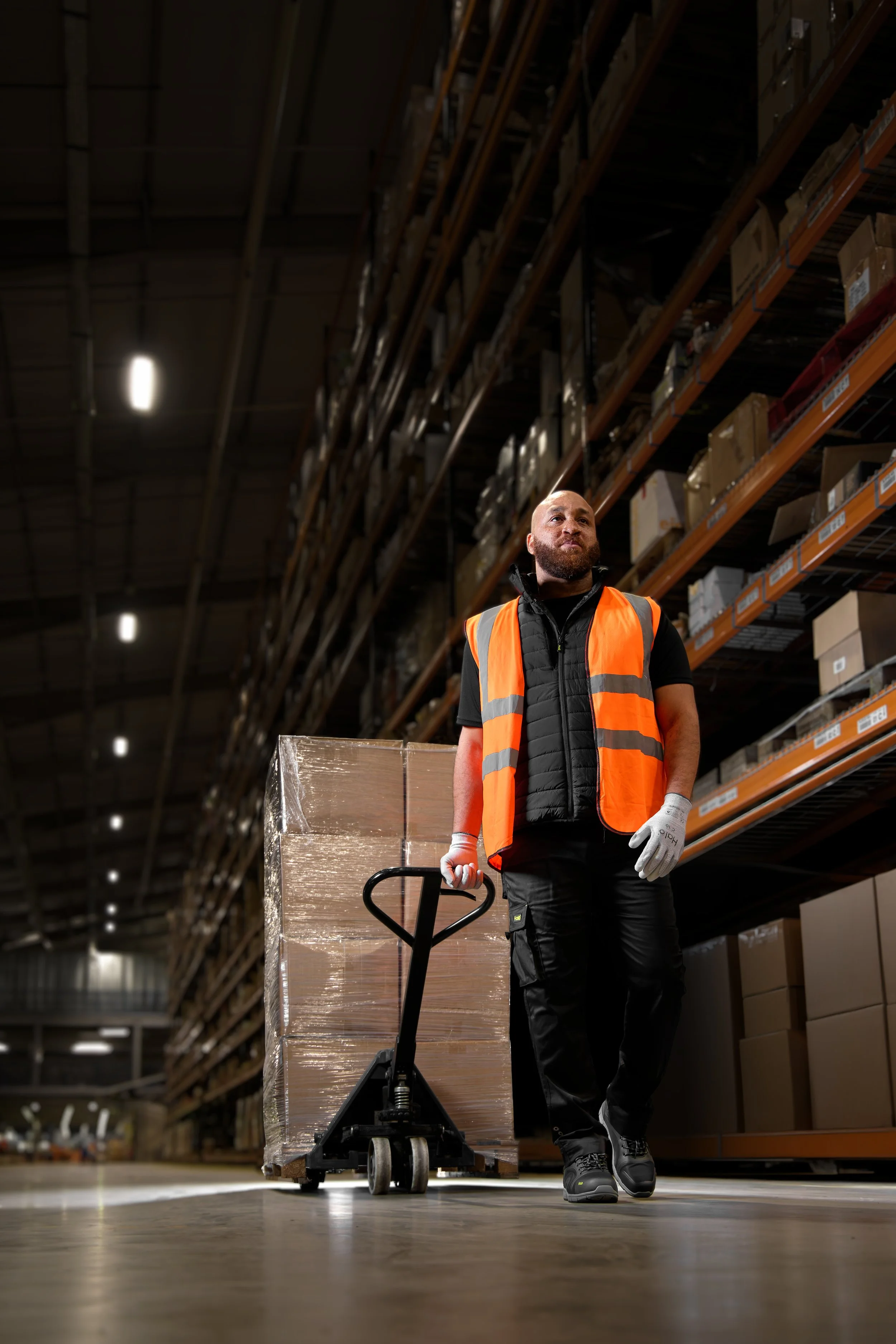 Warehouse photography man with pump truck
