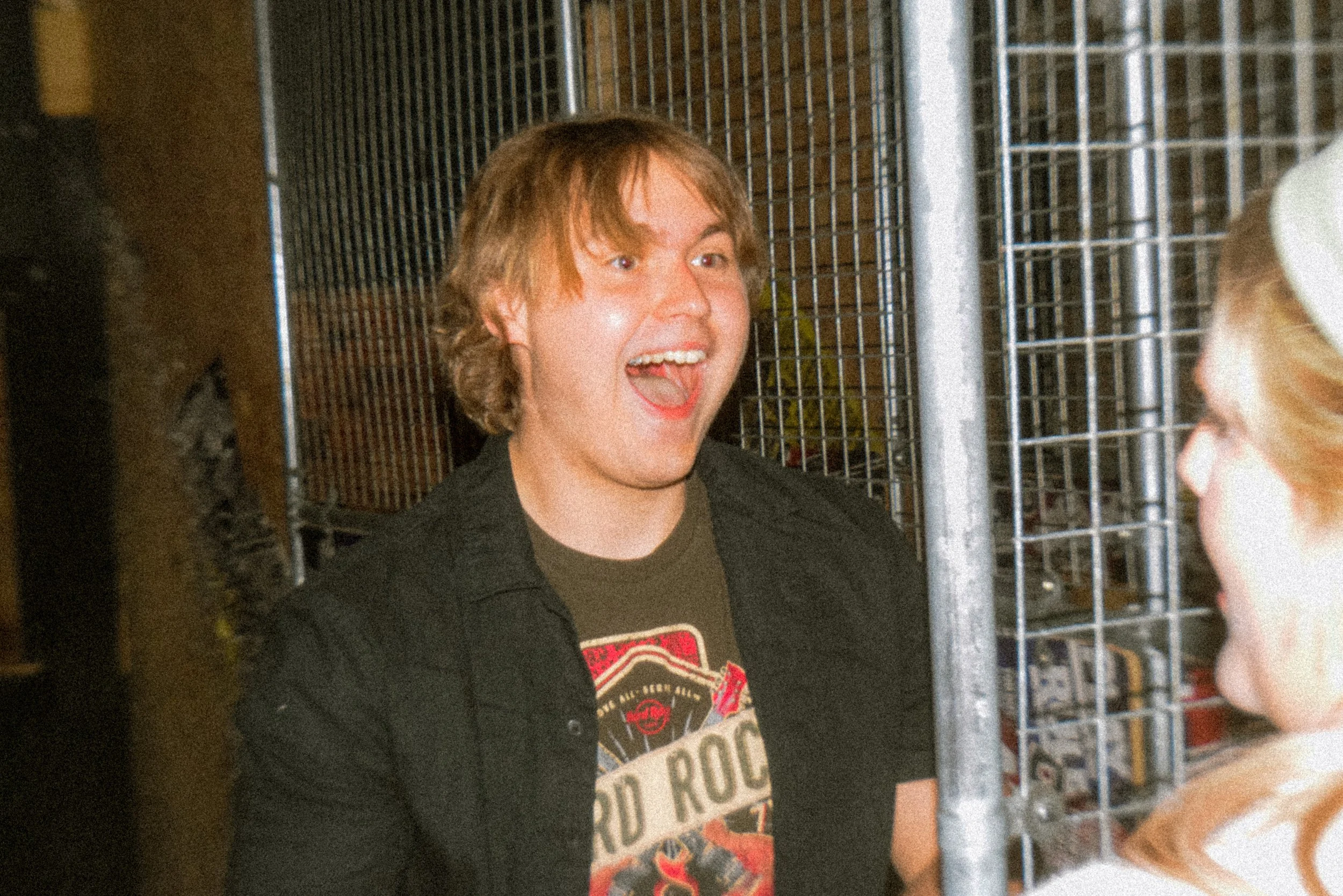 A young man smiling at his friend after a win