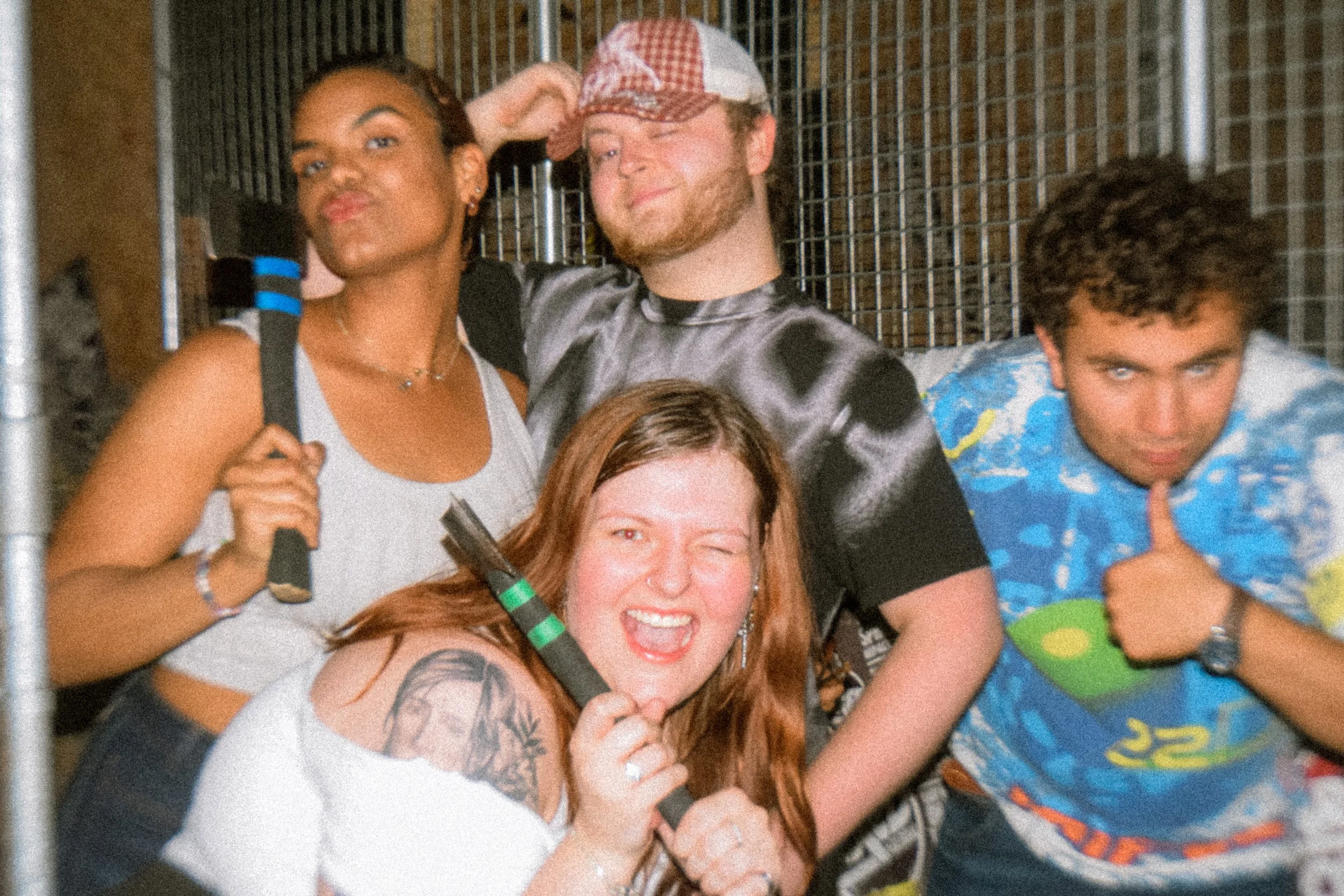 A group of people pose with in a venue