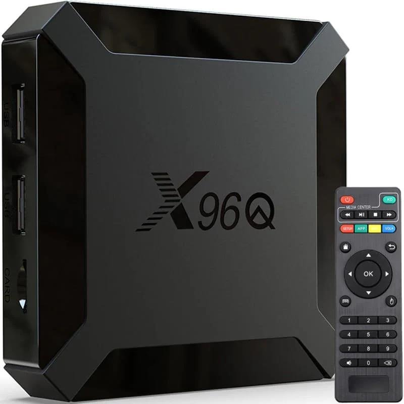 Black electronic device labeled 'X960Q' alongside a remote control.