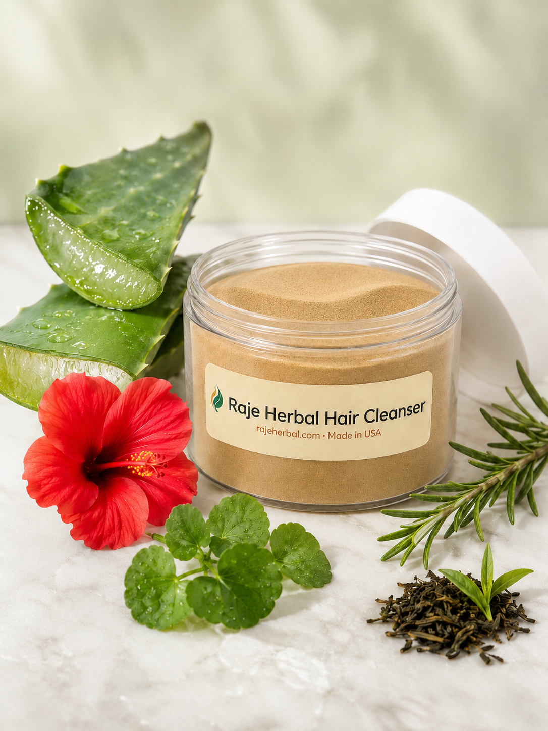 Open jar of Raje Herbal Hair Cleanser herbal powder with aloe vera, hibiscus, rosemary and green tea for gentle cleansing and healthier scalp care.