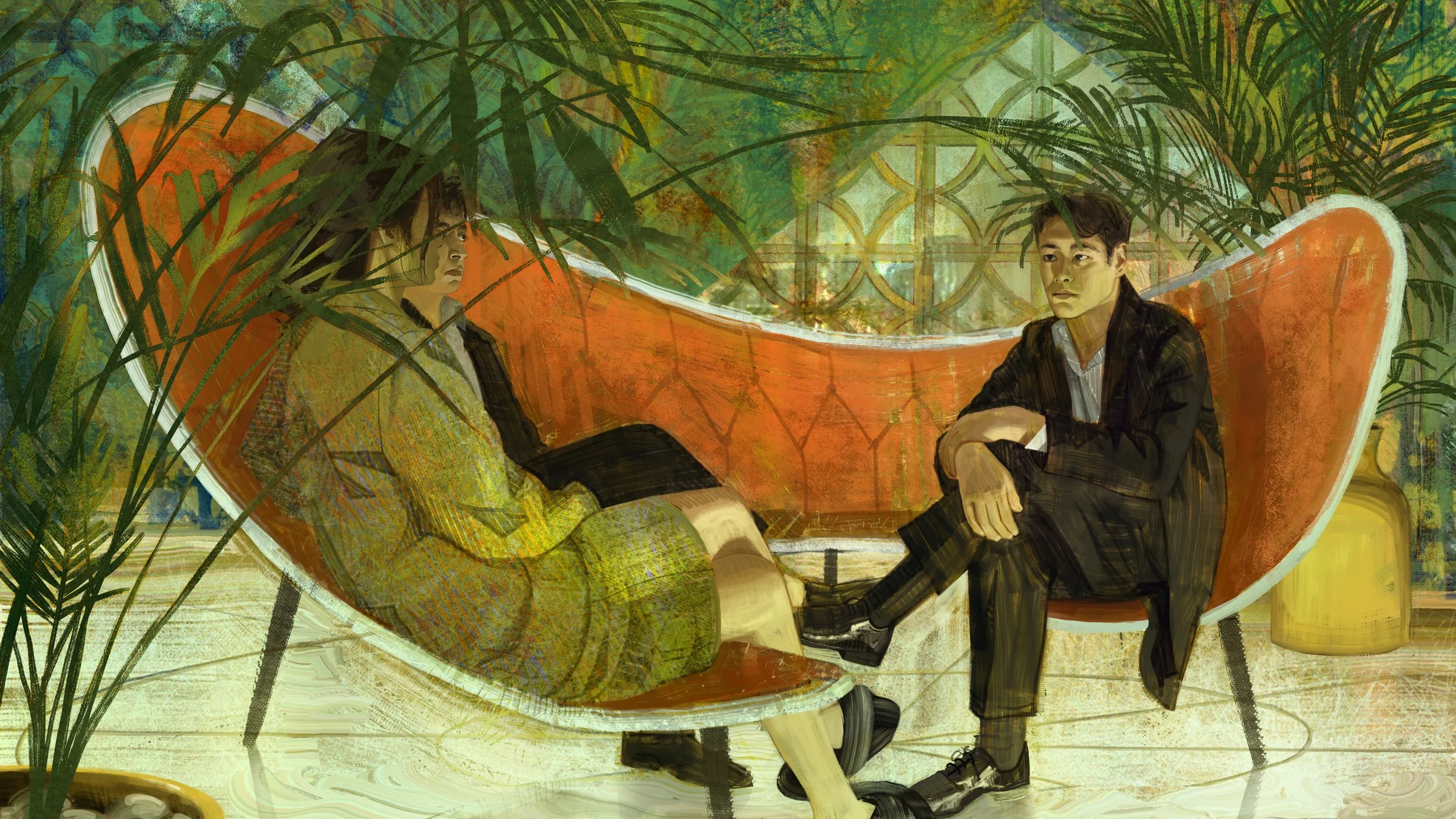 Two young adults sitting on an orange modern sofa inside a room with green plants and patterned glass windows. One person is reclining with arms folded, and the other is sitting upright with arms crossed, both casual.