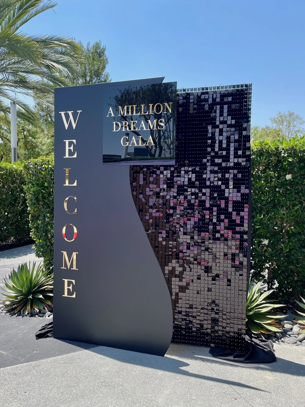 Black shimmer wall welcome backdrop rental for a gala
