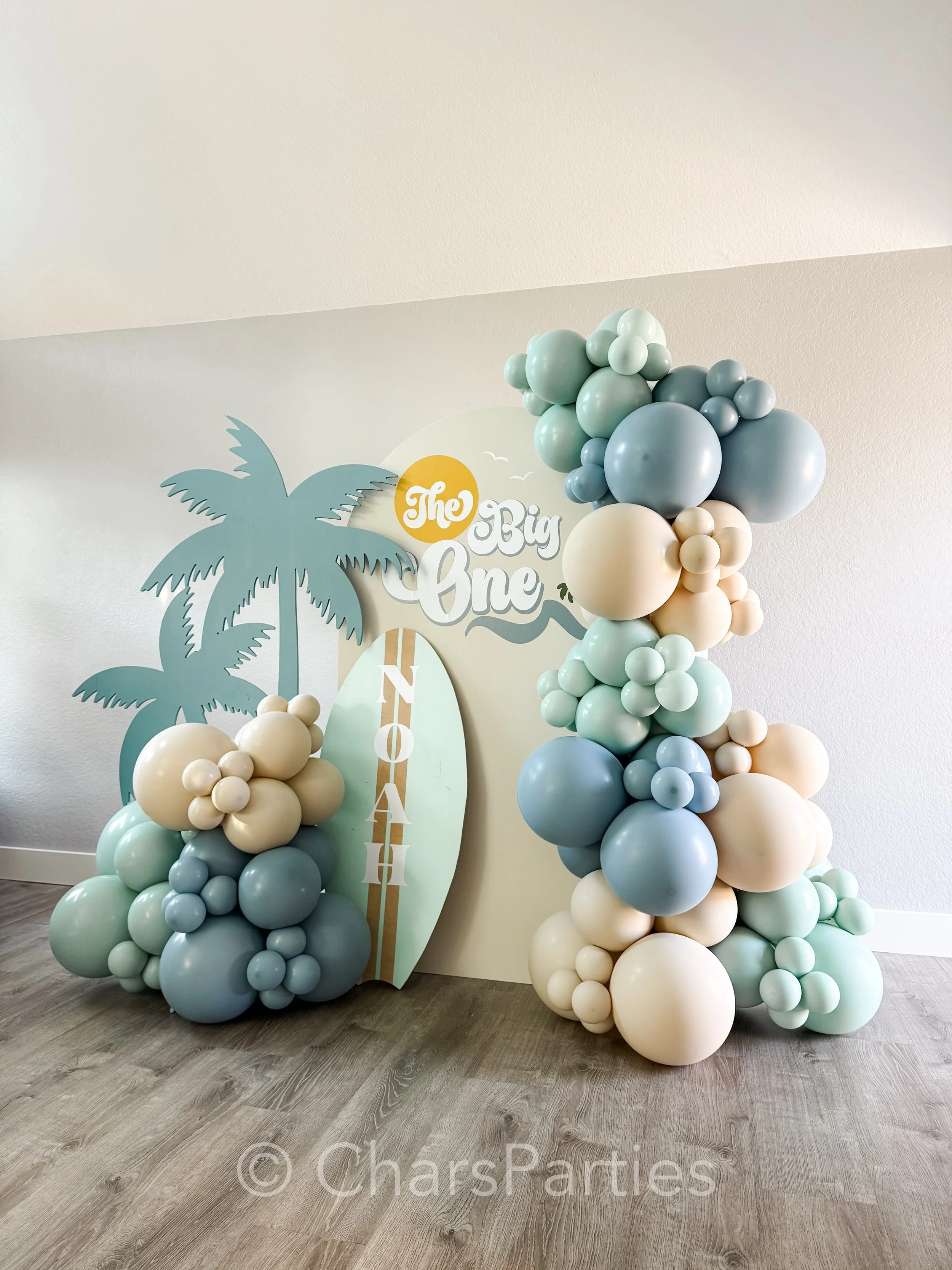 This is a Grab &amp; Go Package! 
Broken down into individual elements, it features a 6ft arch backdrop rental, custom vinyl event logo and name lettering, 2 props: a double palm tree, and and a 4ft surfboard, with 11 feet of balloon garland. 

Every