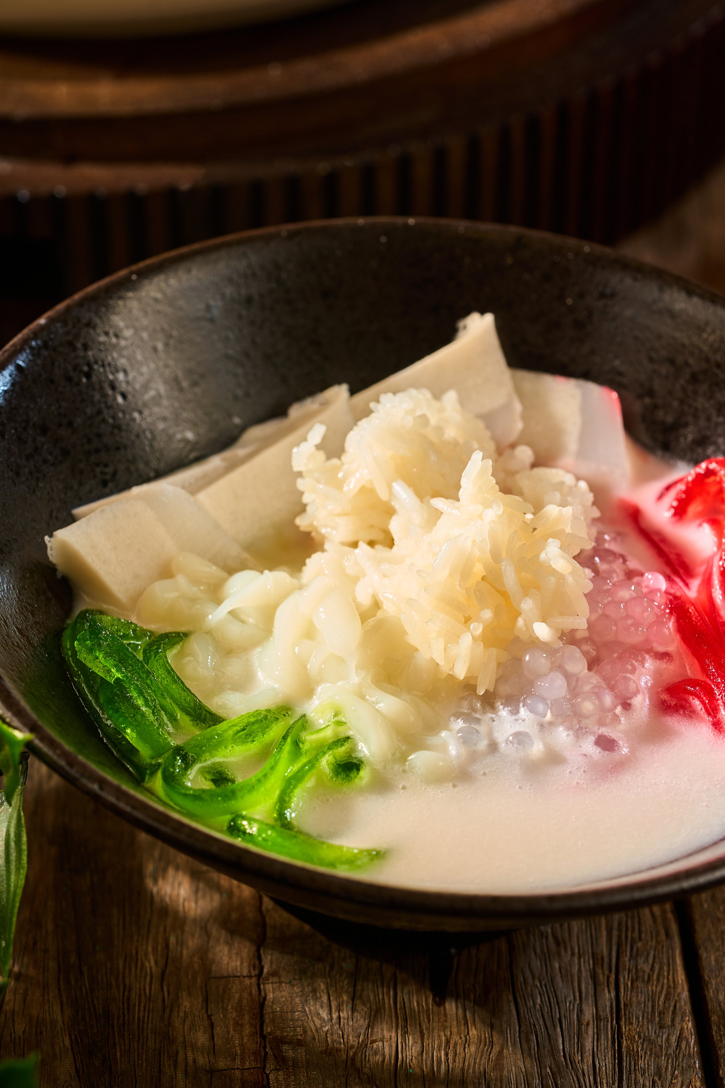 DESSERT SHWE YIN AYE (Traditional Coconut Jelly Dessert)

The legendary king of Myanmar’s street sweets, traditionally shared during the festive Thingyan Water Festival to cool down the community. Rich, chilled coconut milk is filled with handmade pa