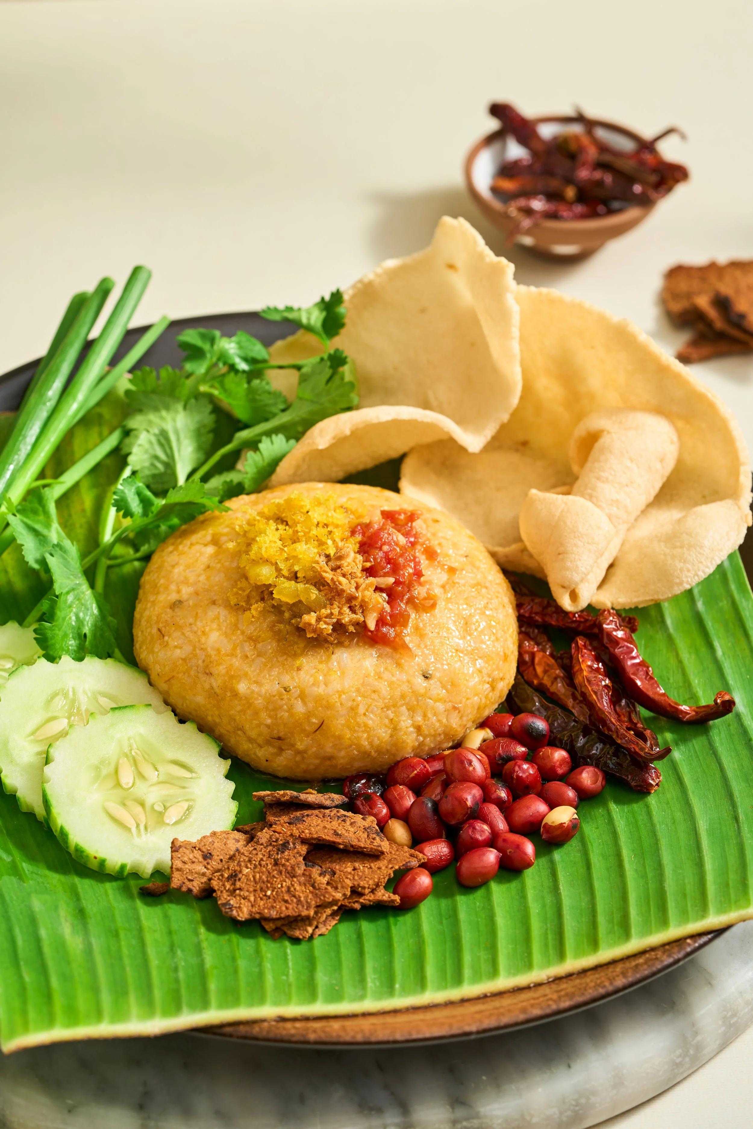 NGAR HTAMIN NEL (Shan Fish Rice)

A masterful highland specialty from the Shan State that transforms humble ingredients into a rich, savory delicacy. Fluffy jasmine rice is kneaded by hand with freshly cooked fish, fragrant turmeric oil, and roasted 