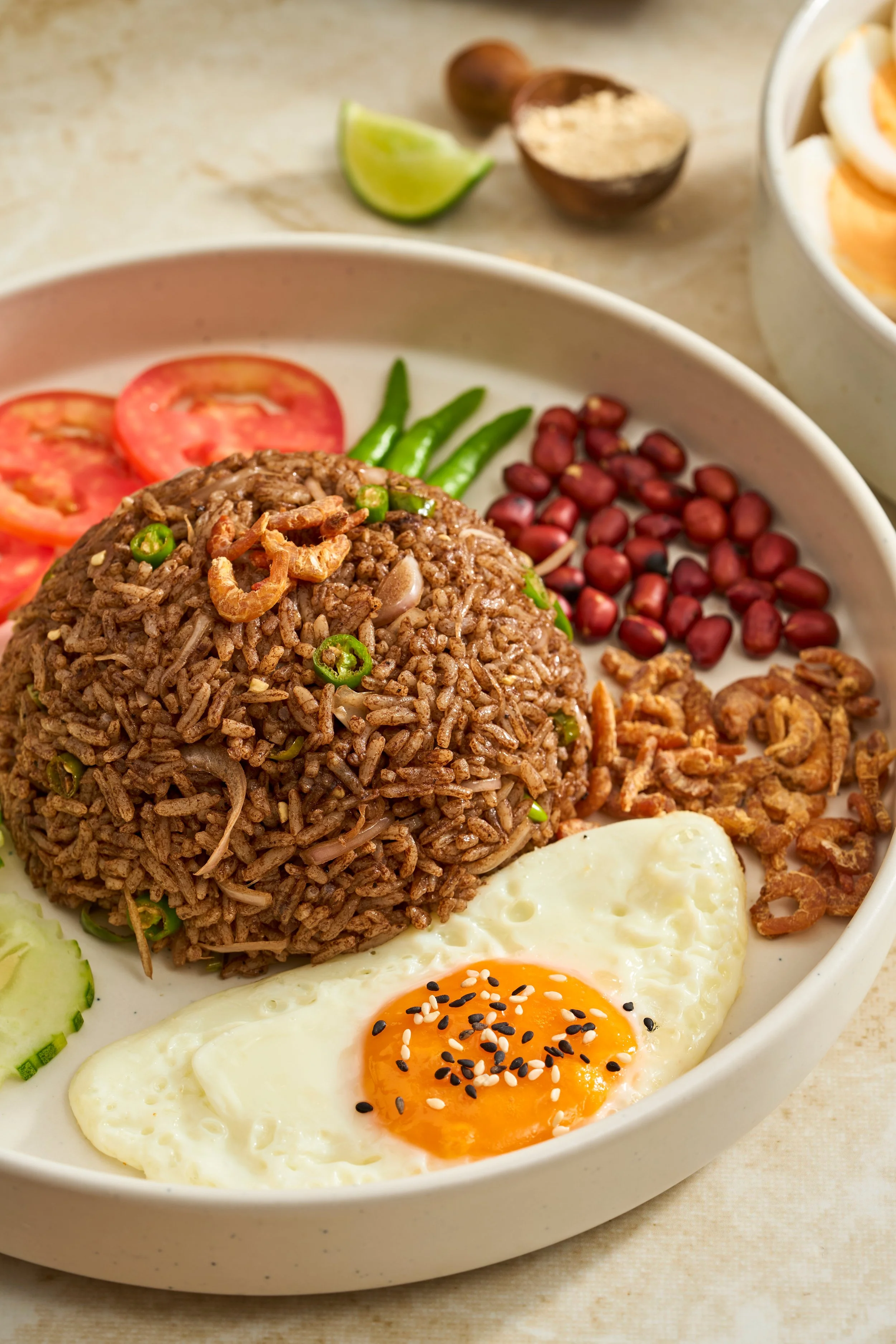 PONE YAY GYI HTA MIN THOKE (Black Pea Paste Rice Salad)

Centered around Pone Yay Gyi—a historic, fermented black bean paste native to the ancient city of Bagan. Fluffy jasmine rice is tossed with this deeply umami paste, fragrant peanut oil, raw sha