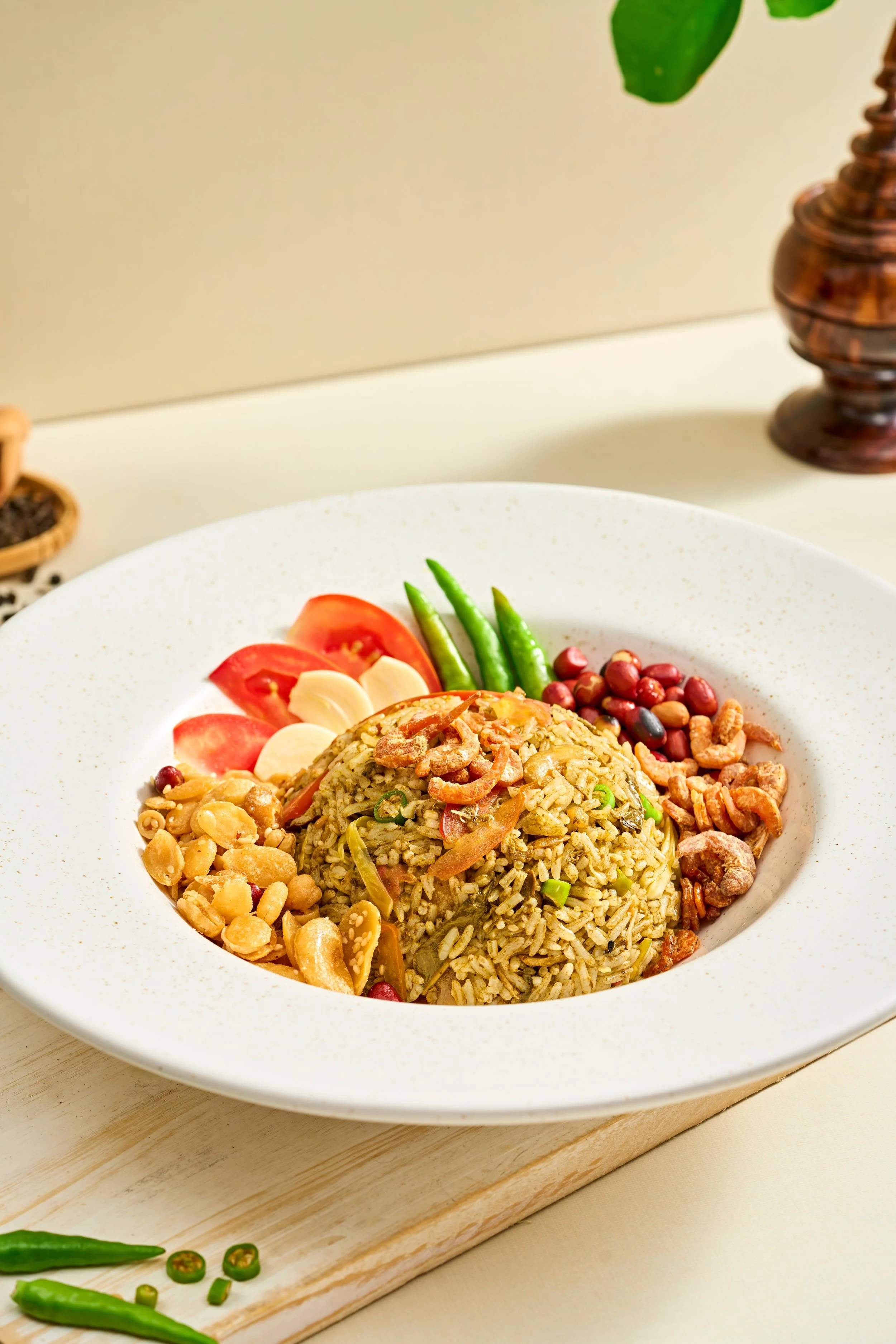 LAHPET HTA MIN THOKE (Tea Leaf Rice Salad)

The ultimate comfort food for tea-loving cultures, blending the elements of a salad into a wholesome rice dish. Steamed jasmine rice is thoroughly hand-kneaded with premium fermented tea leaves, peanut oil,