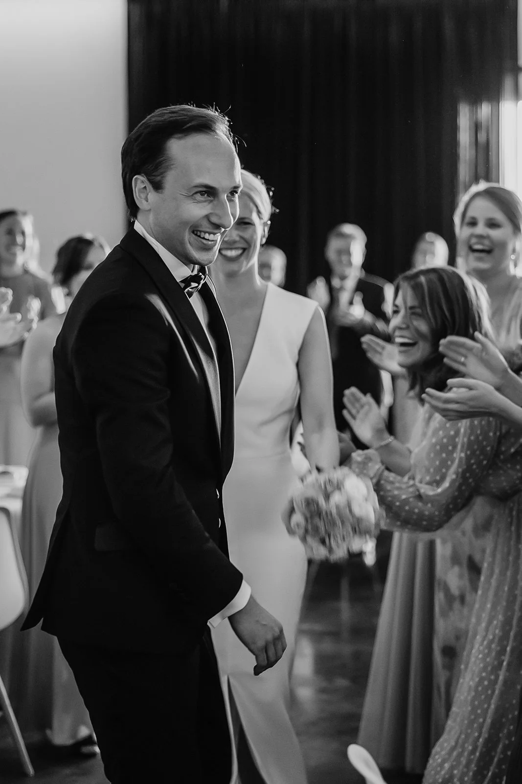Bride and groom entering reception / dinner at 't Convent wedding venue, Lo-Reninge, Belgium