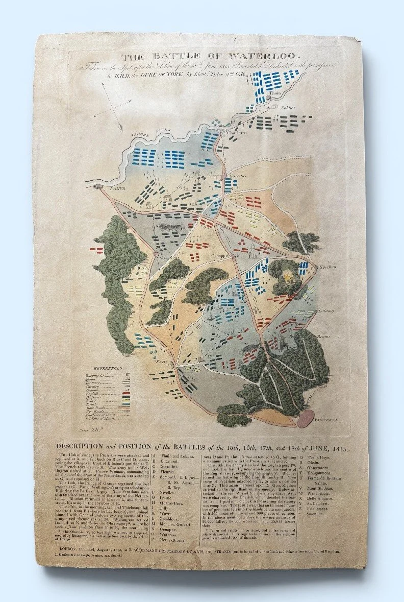 Historical map of the Battle of Waterloo, showing troop positions and movements during the 1815 battle, with various colored sections and terrain features.