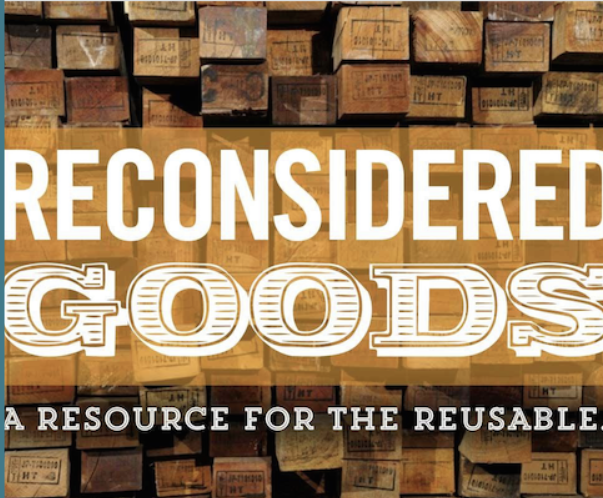 Stacks of cardboard boxes with the words, 'Reconsidered Goods: A resource for the reusable' printed across the front.