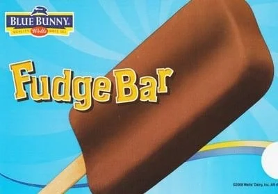 Close-up of a chocolate fudge bar on a wooden stick with Blue Bunny branding and product name on packaging.