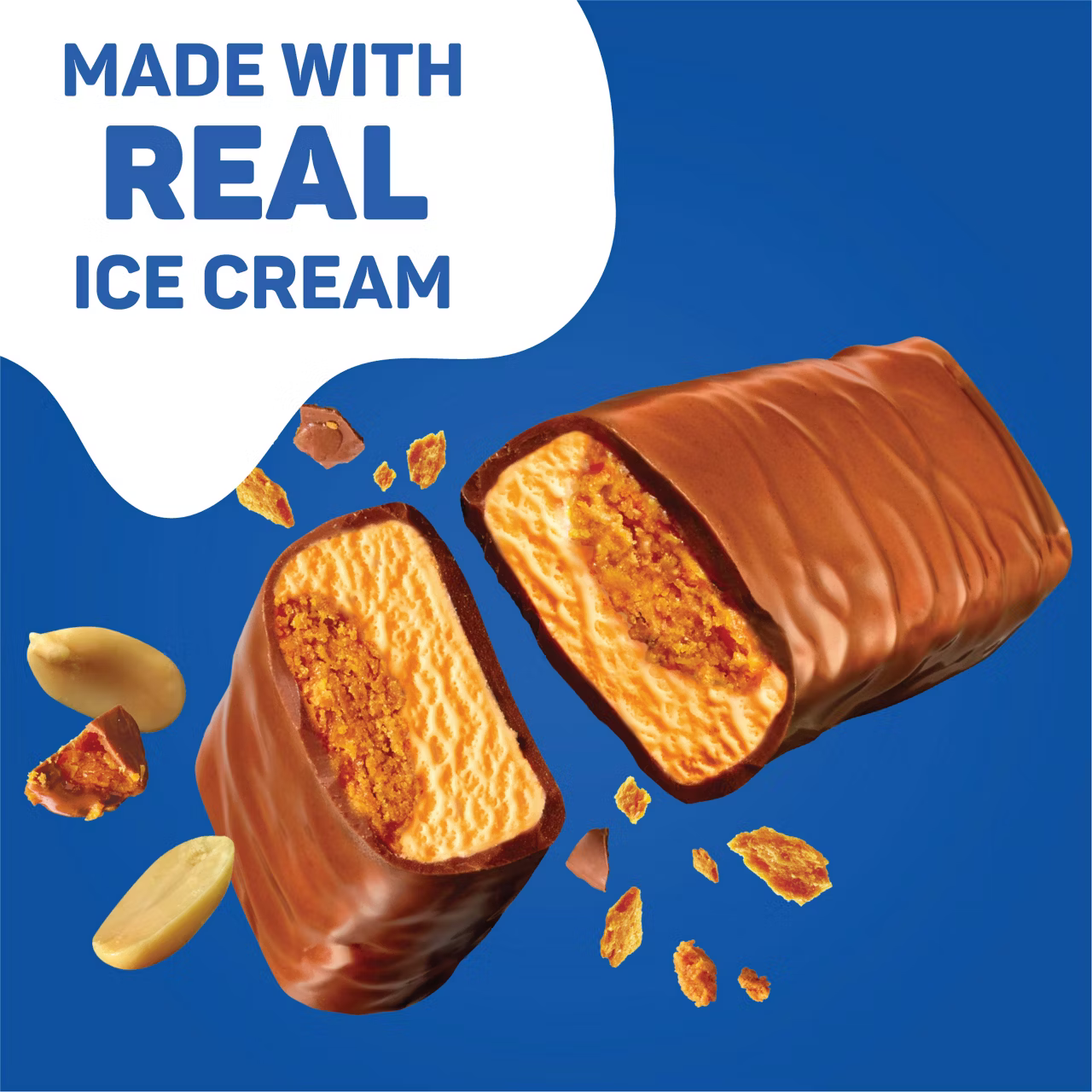 A chocolate-coated ice cream bar cut in half showing caramel, cookie, and vanilla ice cream filling, with scattered nuts and cookie crumbs against a blue background and a text bubble reading "Made with real ice cream."