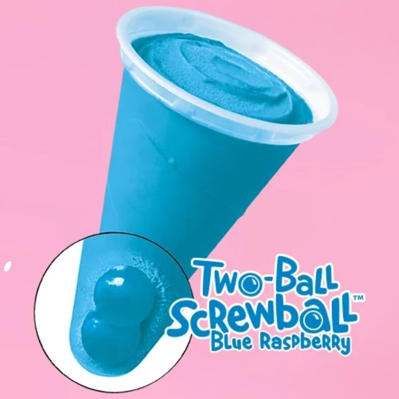 A blue raspberry flavored slushie drink in a large blue cup set against a pink background, with an illustration of two blue raspberry balls next to the text "Two-Ball Screwball Blue Raspberry."