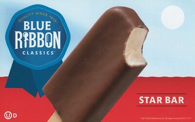 Close-up of a partially eaten Blue Ribbon Star Bar ice cream bar against a blue sky background.