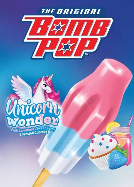 Packaging of a Bomb Pop ice pop with unicorn-themed branding, including a cartoon unicorn with wings, and a cotton candy, lemon slice, and berry-flavored beverage with a cupcake.