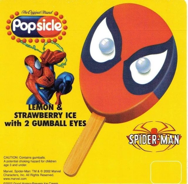 A vintage Popsicle ice cream bar with Spider-Man face, lemon and strawberry flavor, and gumball eyes, on a bright yellow background.