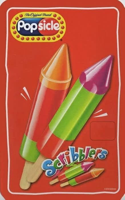 Box of Popsicle Scribblers, colorful crayon-shaped ice pops with orange, green, and purple sections.