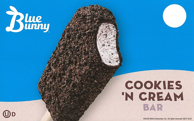 Blue Bunny Cookies 'N Cream Bar with a bite taken out, showing the cookies and cream filling, against a blue background with a white moon.