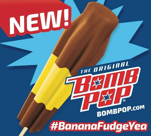 Advertisement for a new banana Fudge flavored BOMB POP, with the website BOMBPOP.COM and hashtag #BananaFudgeYea.