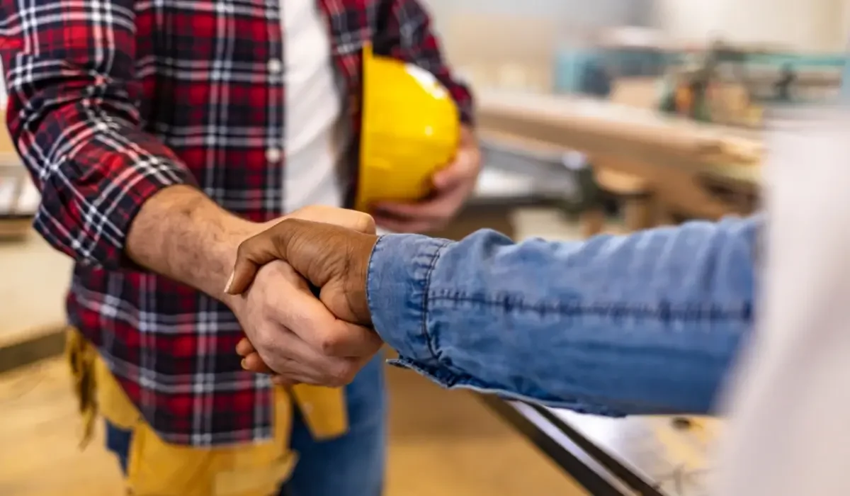 Homeowner and contractor shaking hands
