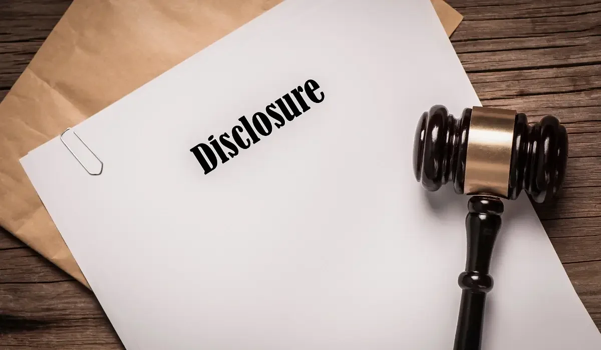 Real estate disclosure document beside a gavel