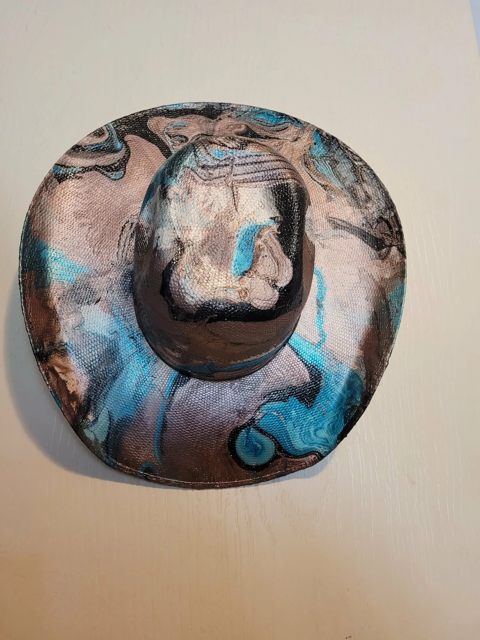 Second 'wrecked hat' Hydro dipped straw hat in bronze, black and turquoise.