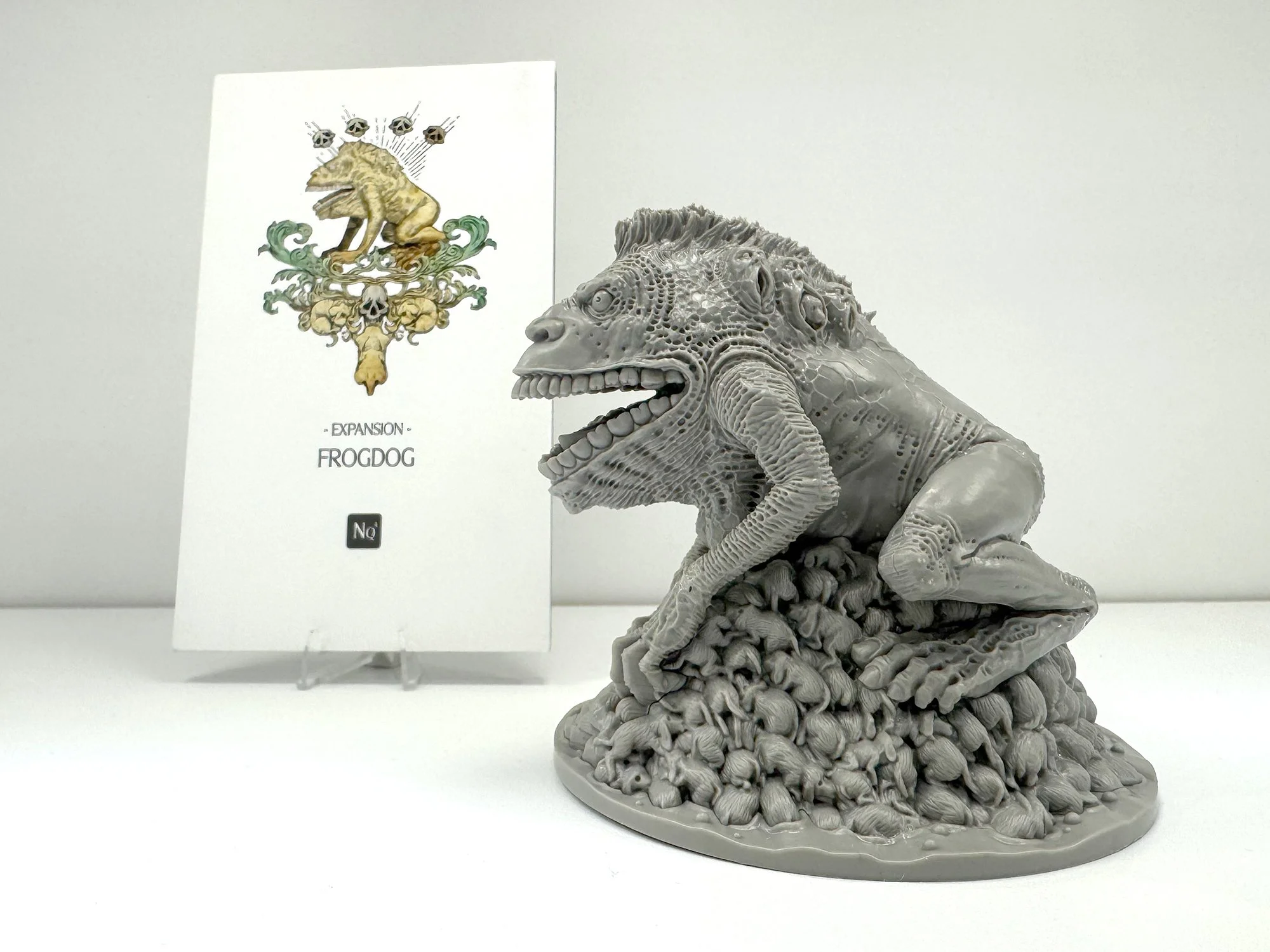 Photo of a 3d-printed miniature called "frog dog" from the "Kingdom Death" tabletop game.