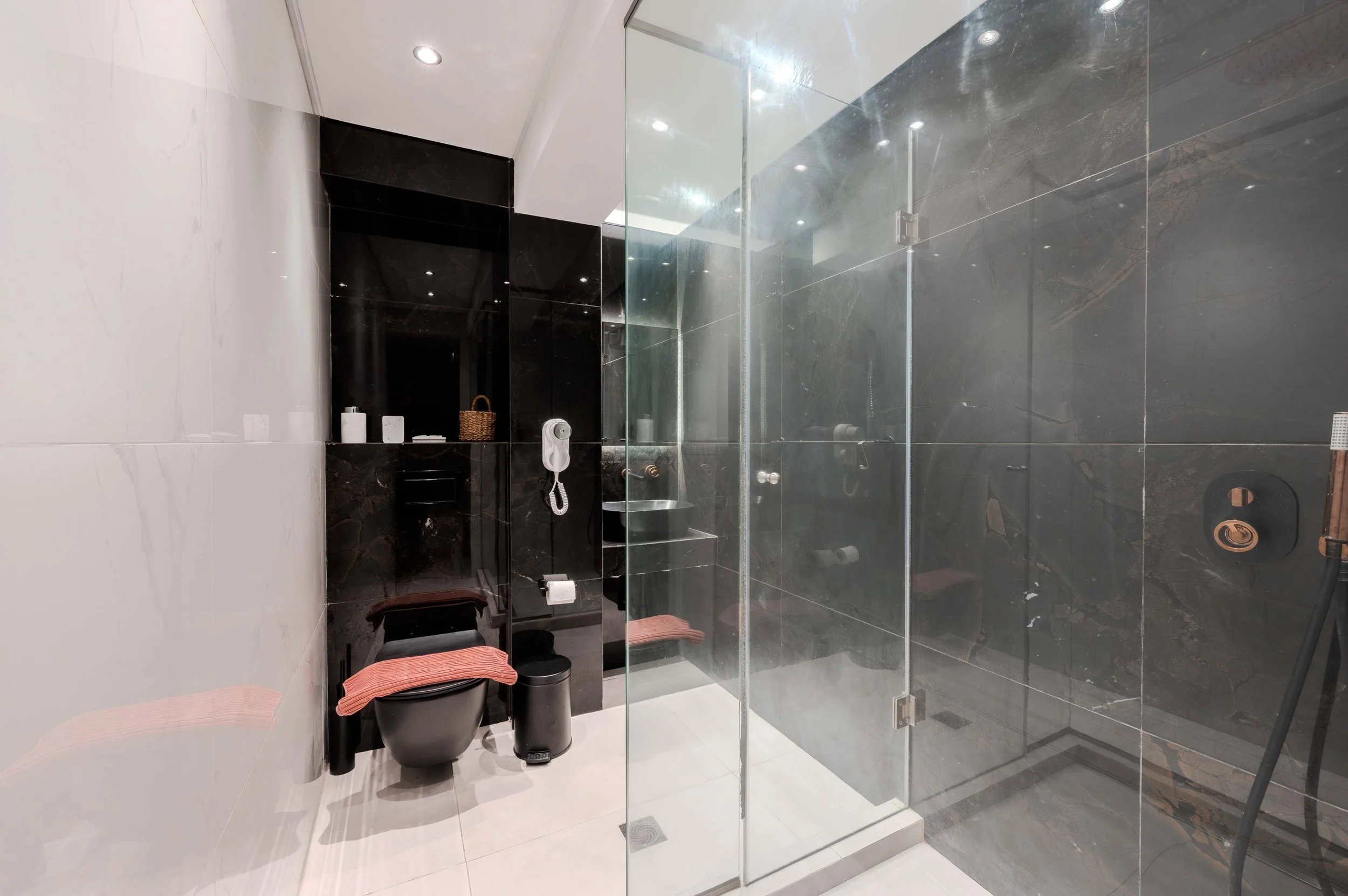 Luxury is found in the details.

A spacious walk-in shower, elegant finishes, and a contemporary design create a bathroom that feels as relaxing as the rest of your stay. Every corner of Metsikas Residence is thoughtfully designed for your comfort.


