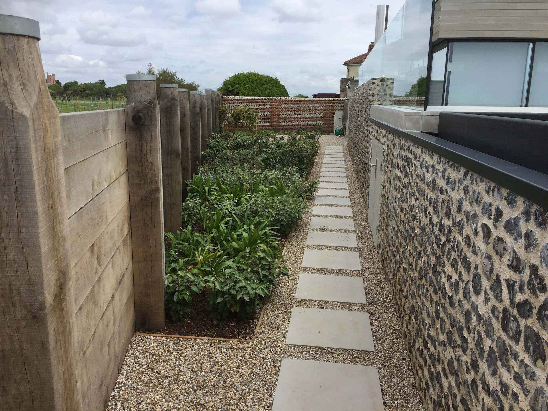 flint-boundary-wall-landscaped-path-marine-drive-west-wittering-wscb..jpg