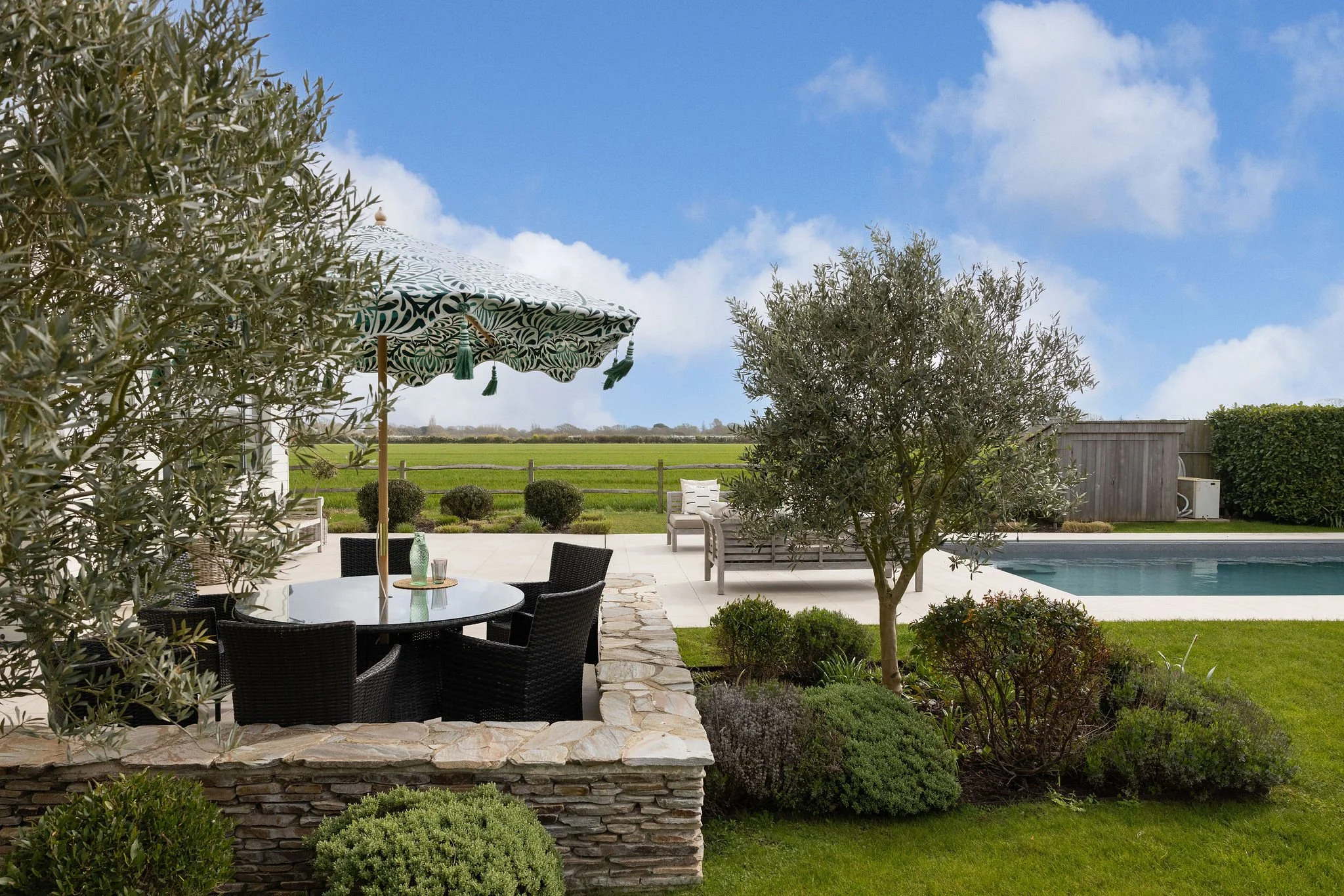 tone-walled-patio-dining-area-pool-birdham.jpg
