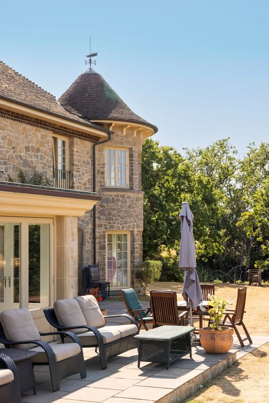 rear-patio-dining-terrace-turret-stone-house.jpg