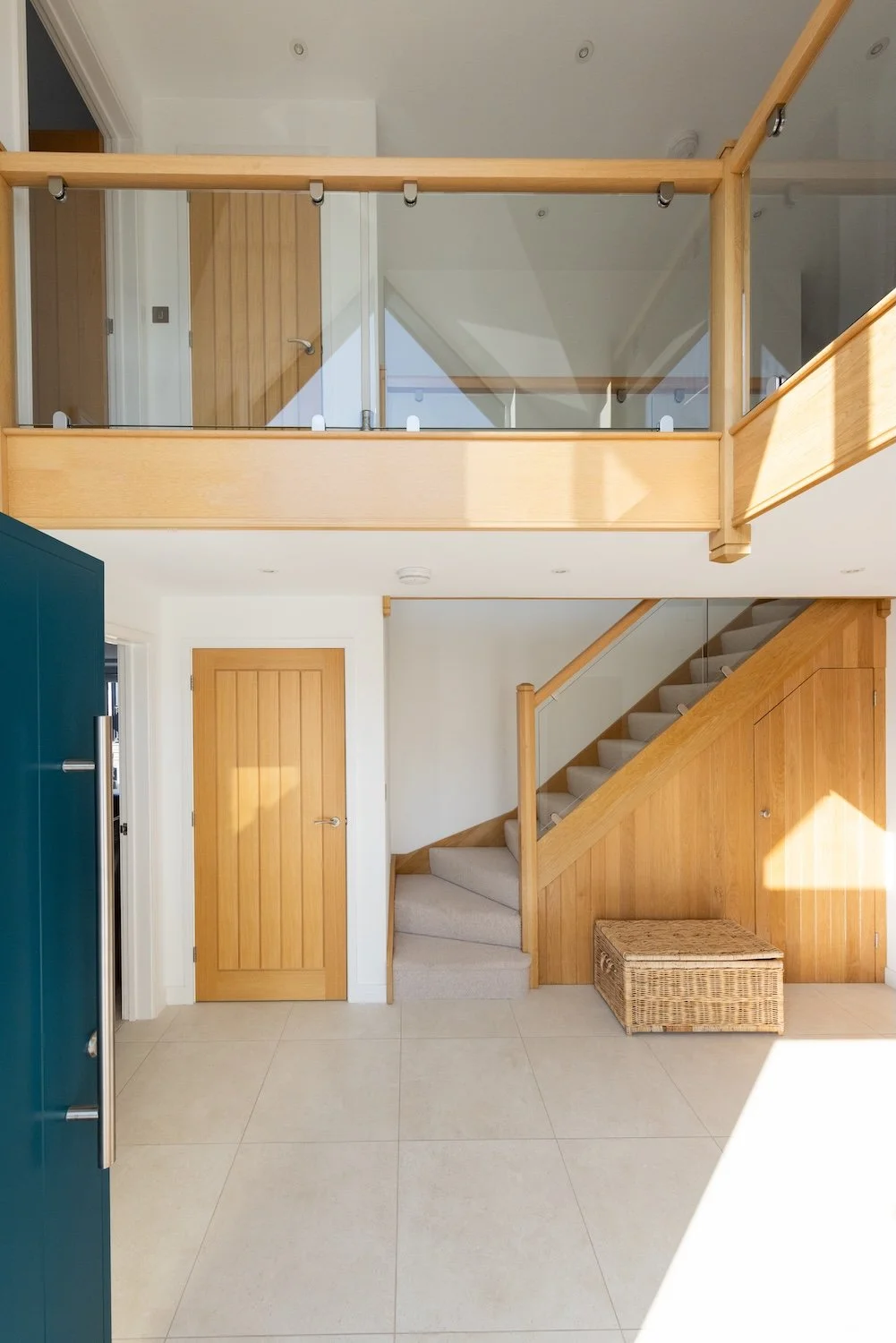double-height-entrance-hall-oak-glass-staircase-selsey.jpg