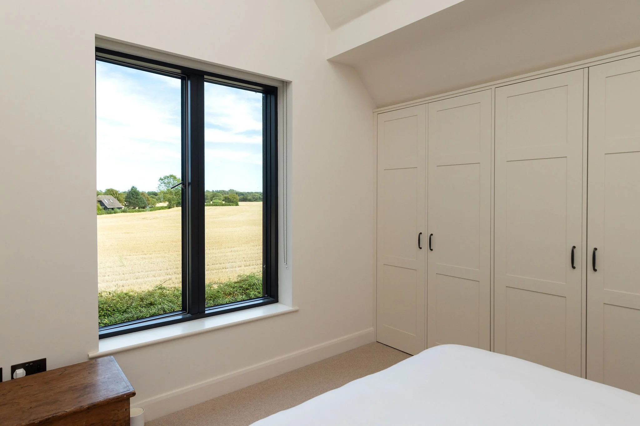 wscb-fitted-bedroom-wardrobes-rural-casement-window-view-bosham.webp