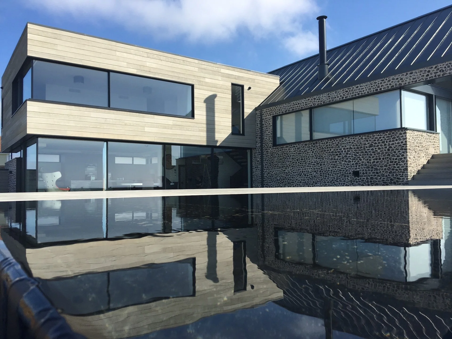 contemporary-flint-house-pool-reflection-marine-drive-west-wittering-wscb.jpg