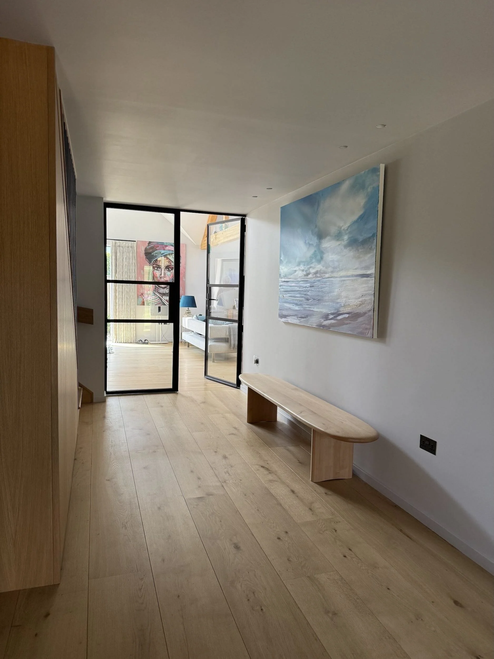 oak-flooring-entrance-hall-black-steel-doors-itchenor.jpeg