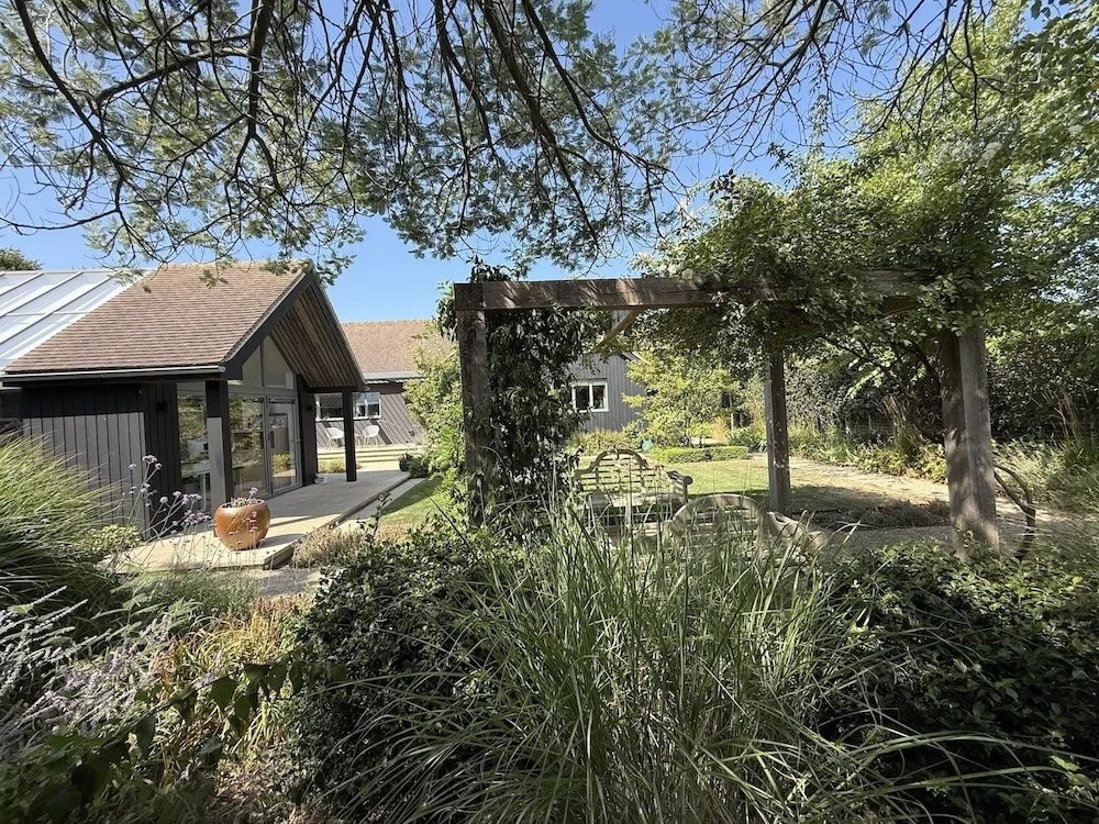 black-timber-clad-extension-pergola-garden-view-itchenor.jpeg