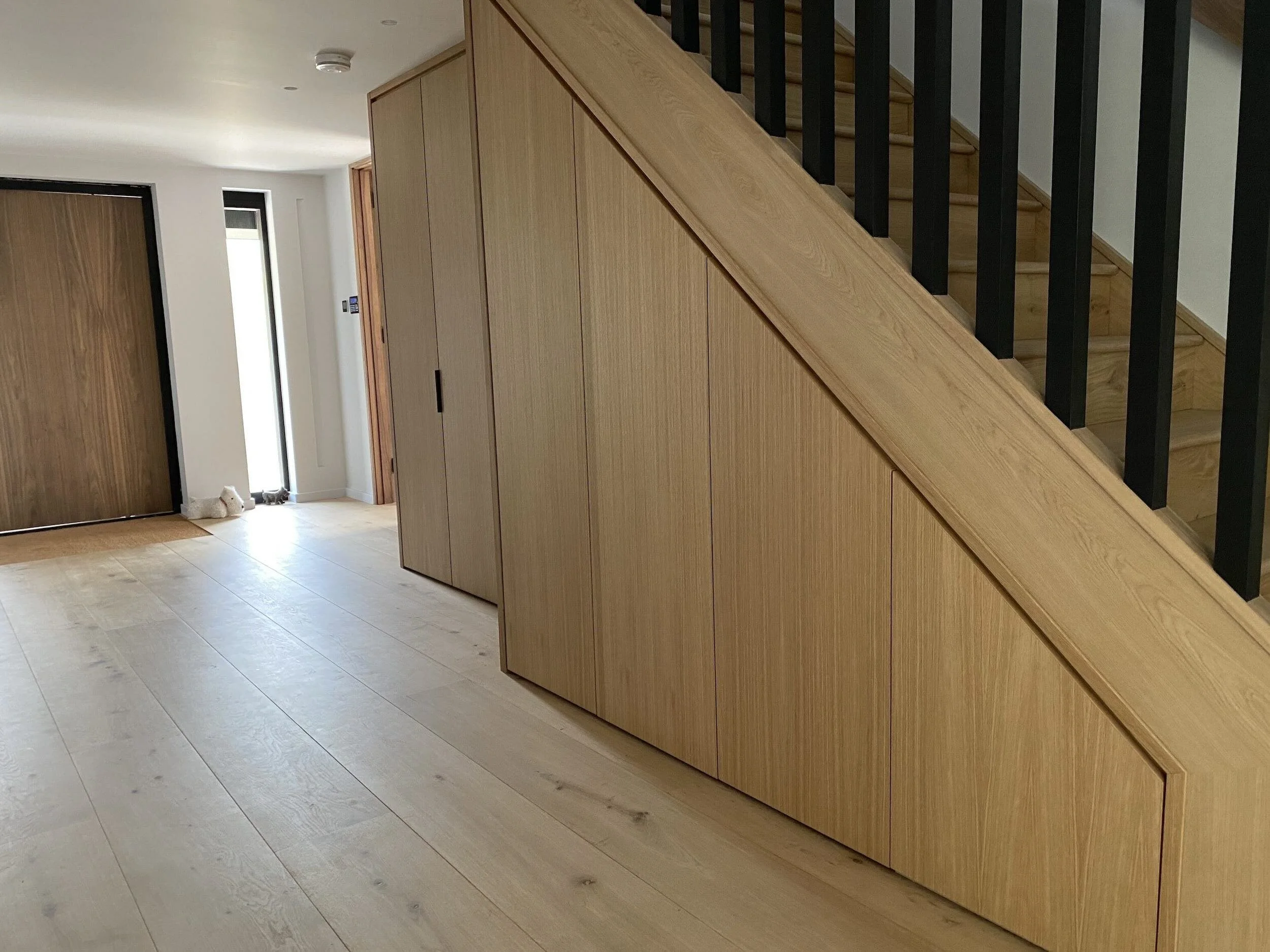 under-stairs-fitted-storage-custom-oak-staircase-sussex.jpeg