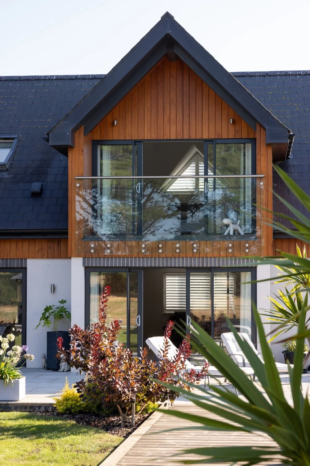 gabled-bedroom-suite-glass-balcony-sliding-doors-selsey.jpg