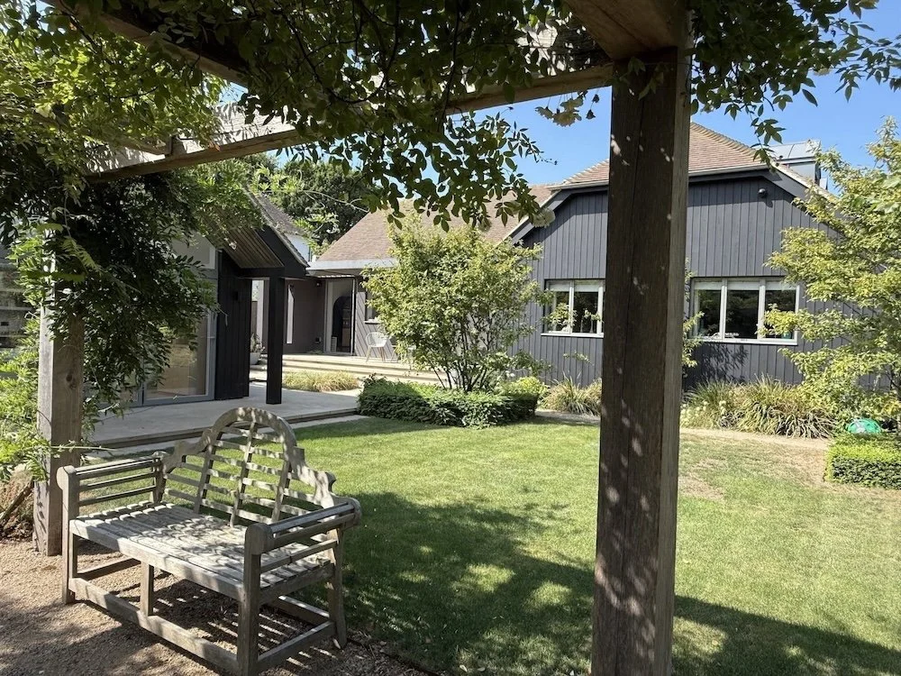 timber-pergola-lawn-view-black-clad-house-itchenor.jpeg