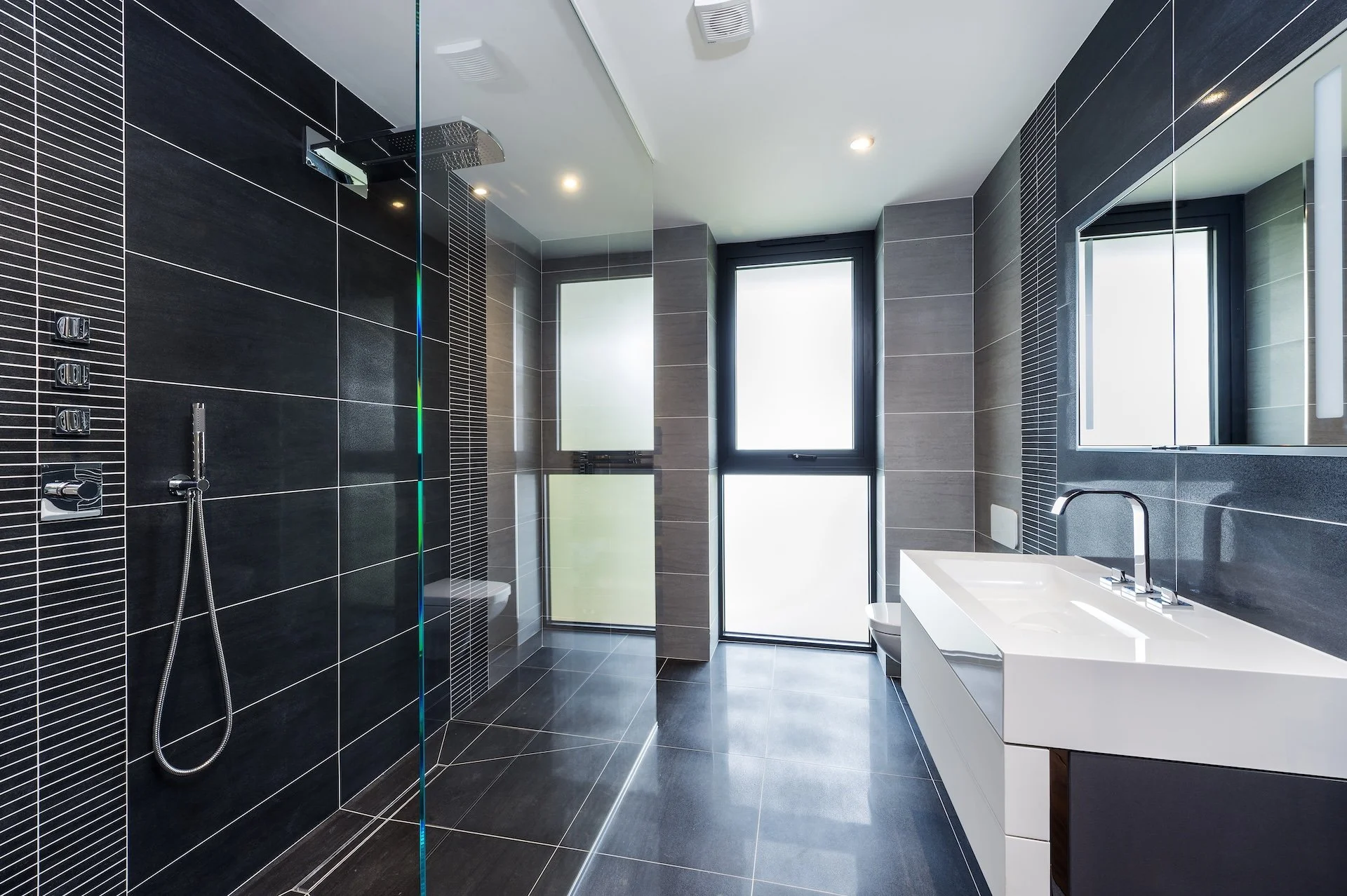 wscb-dark-tile-luxury-wetroom-shower-floating-vanity.webp