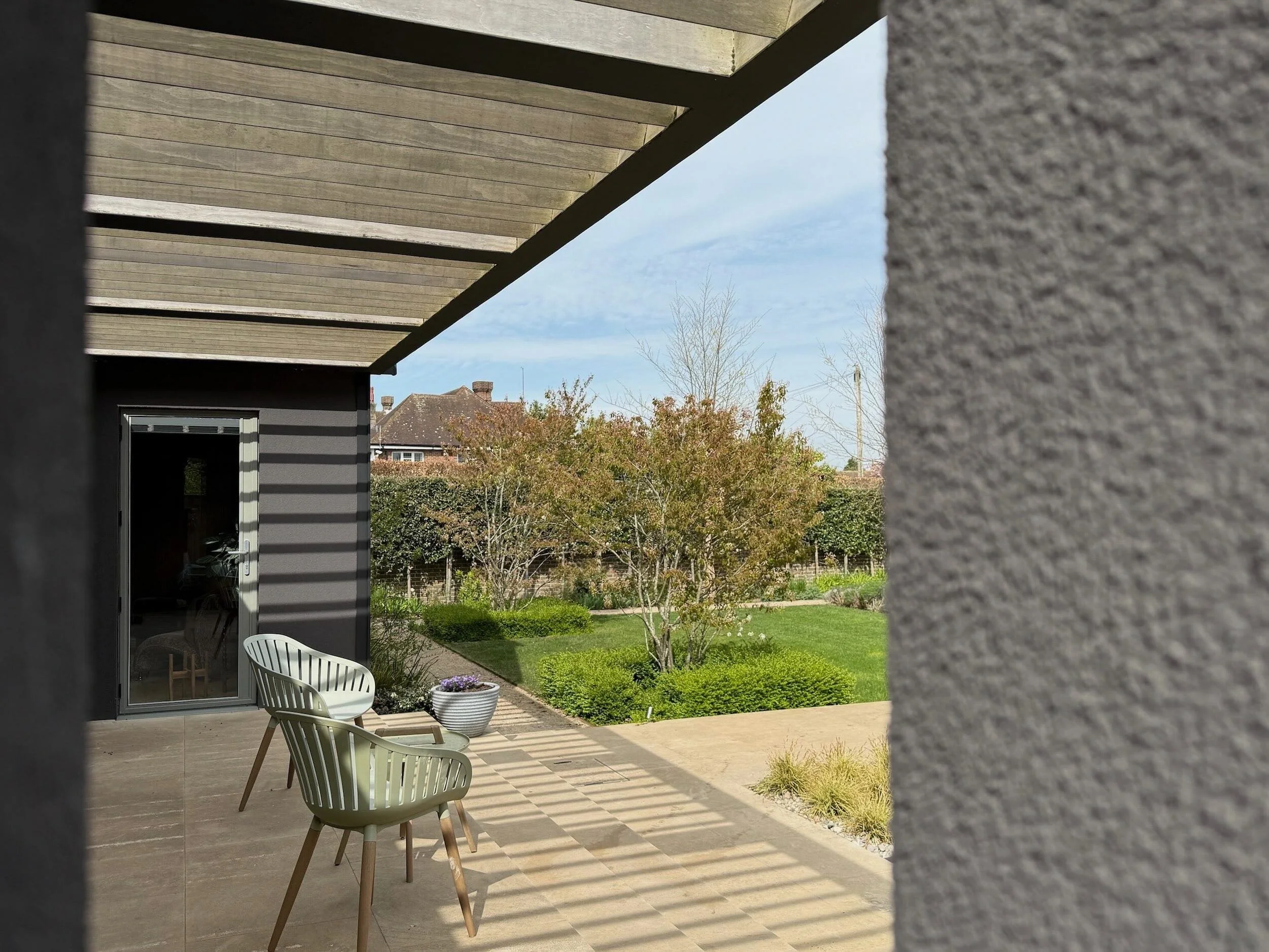 covered-patio-pergola-shadows-landscaped-garden-itchenor.jpeg