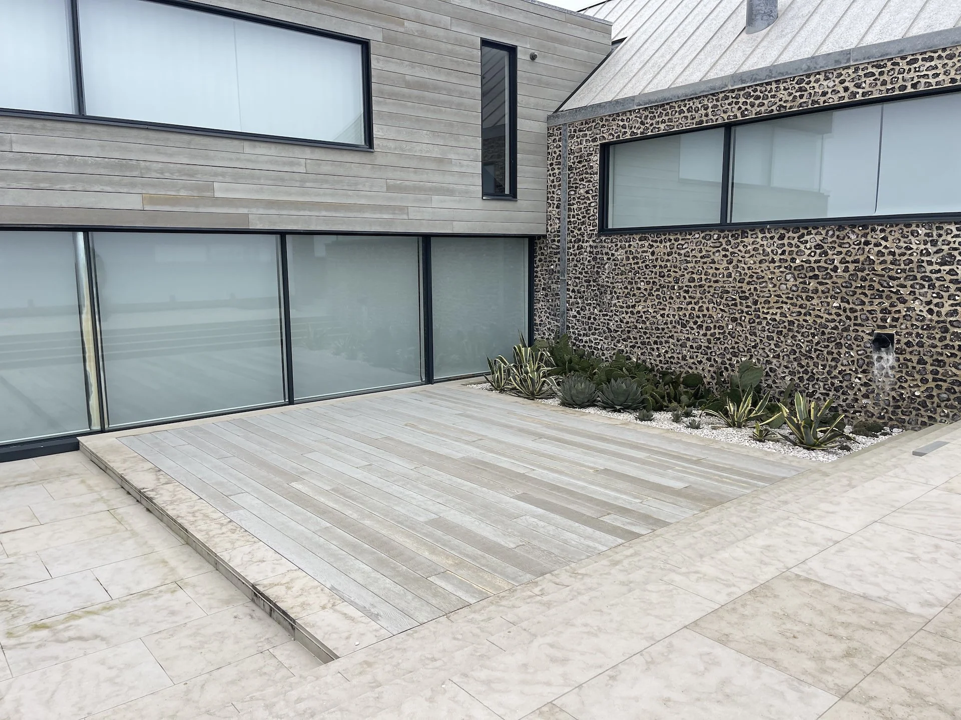 sunken-decking-courtyard-flint-wall-marine-drive-west-wittering-wscb.jpeg