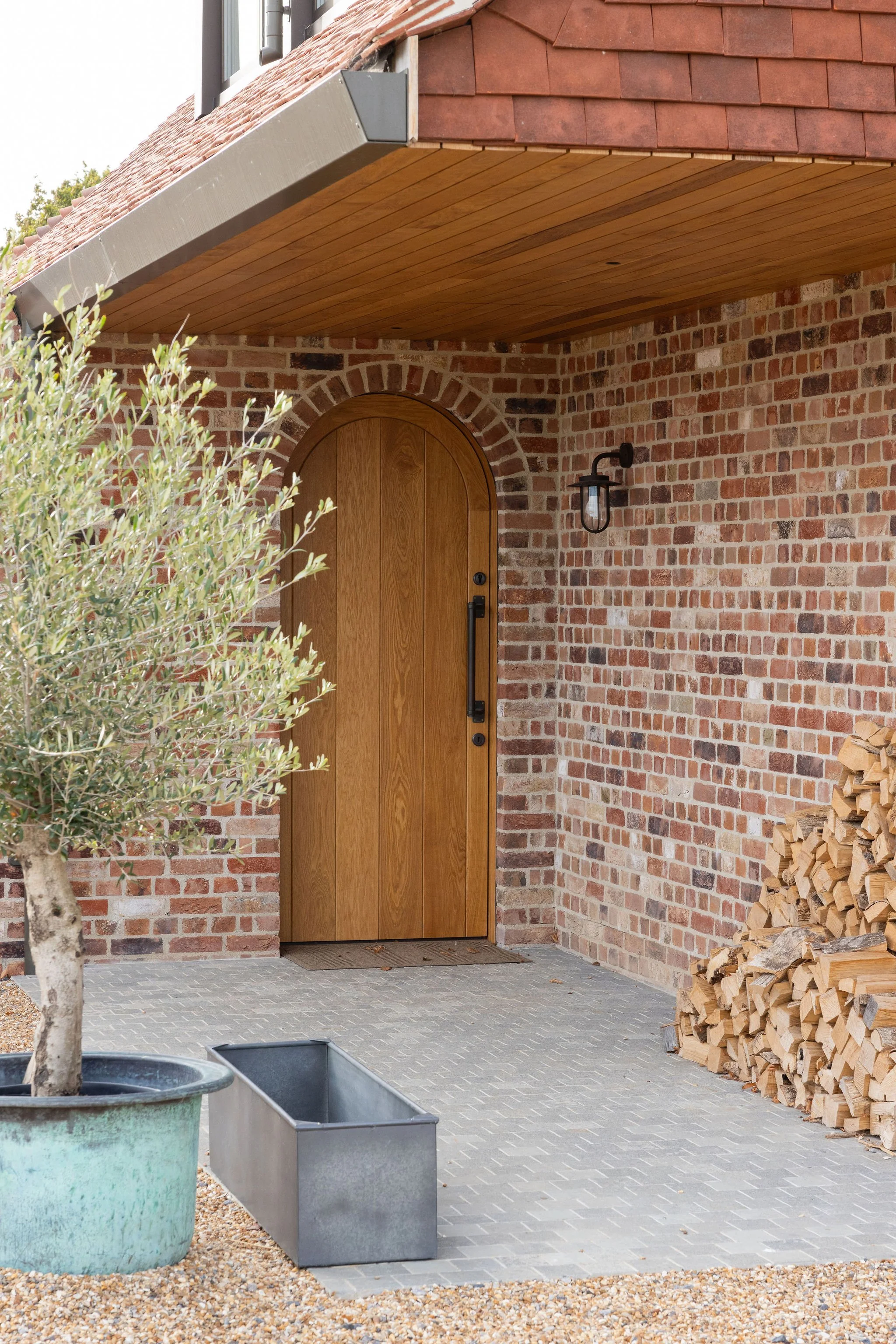 wscb-bespoke-arched-oak-front-door-porch-bosham-west-sussex.webp