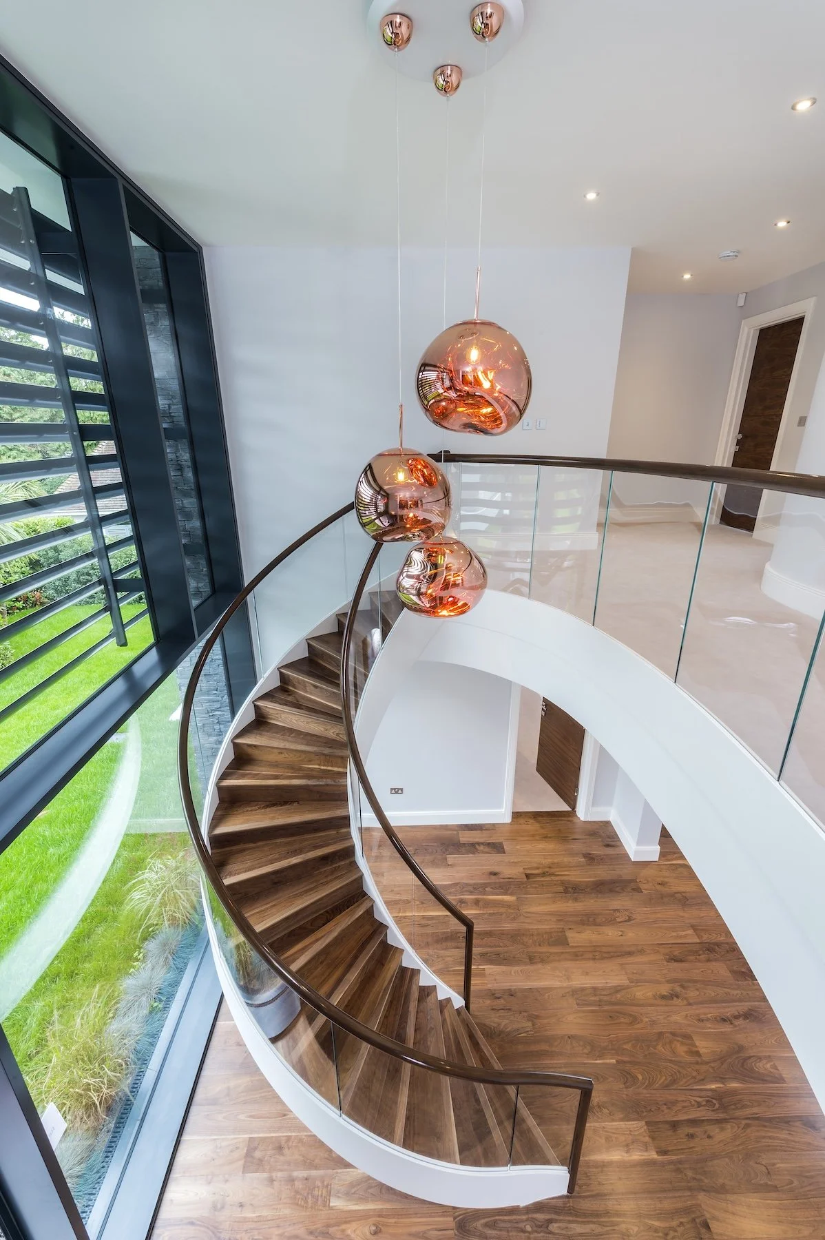 wscb-feature-curved-staircase-double-height-glazing-itchenor.webp