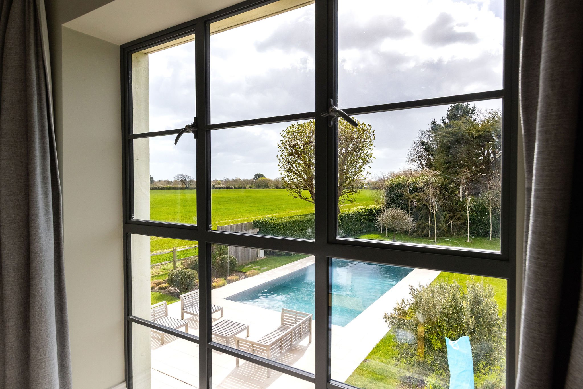 bedroom-window-overlooking-swimming-pool-harbourside-birdham.jpg