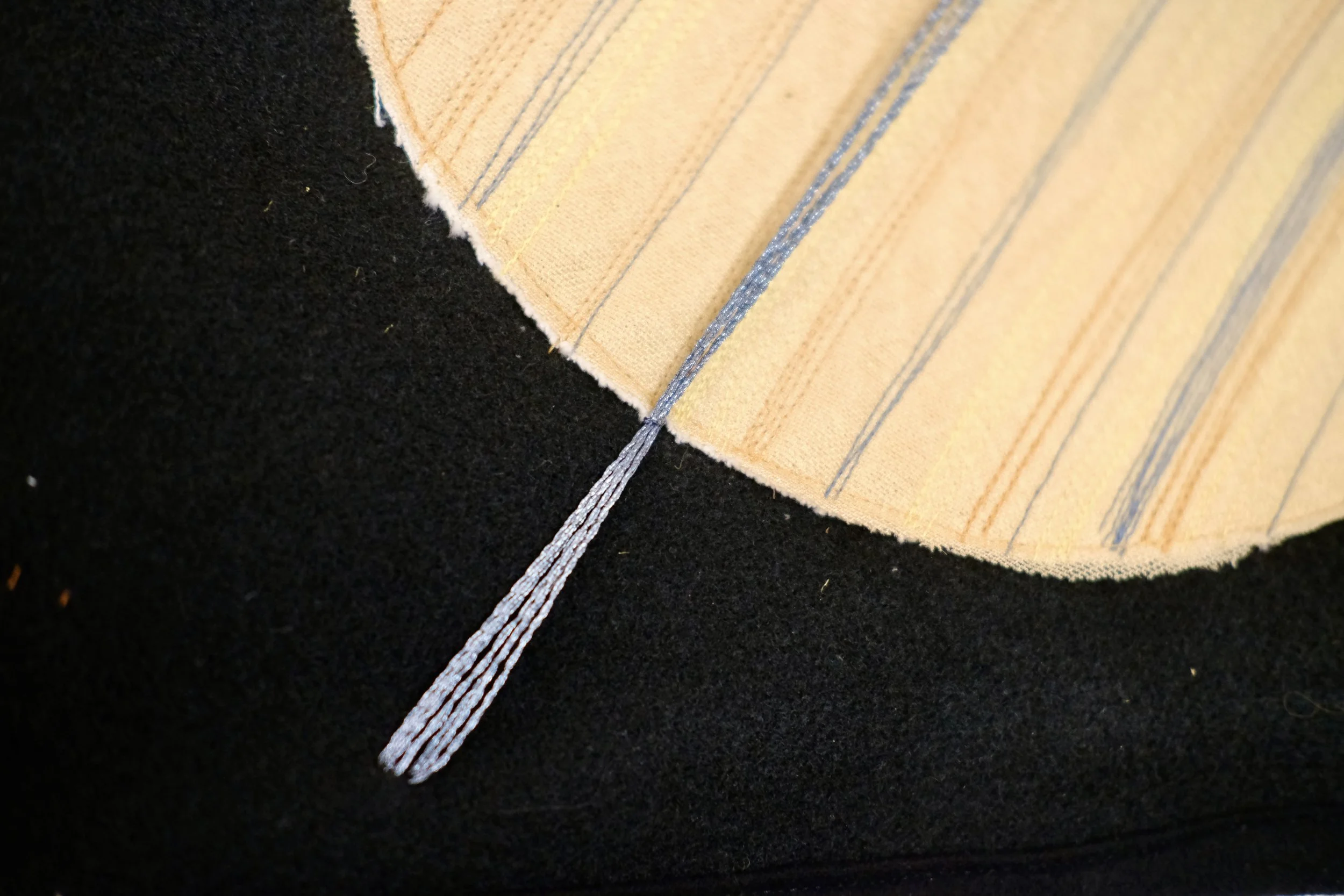 Handstitched Saturn planet wall hanging, layered fabrics and multiple threads 