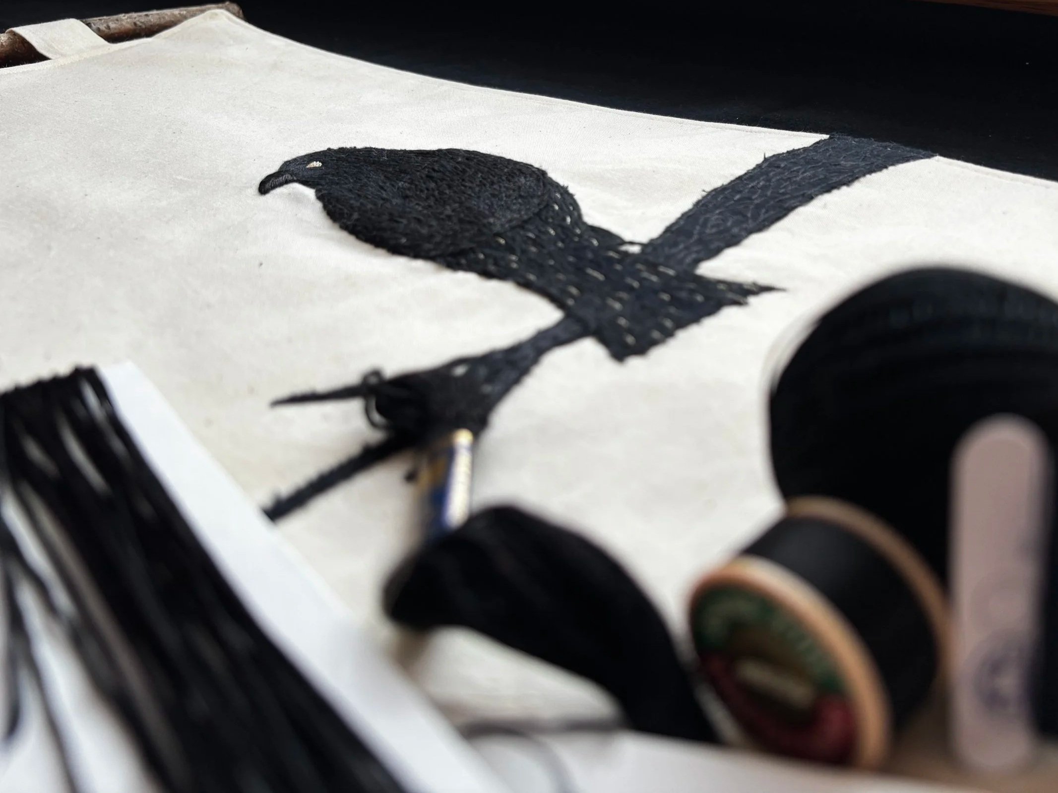 fabric and embroidered raven celebrating the north woods of the united states, boundary waters of the usa and Minnesota hand made art