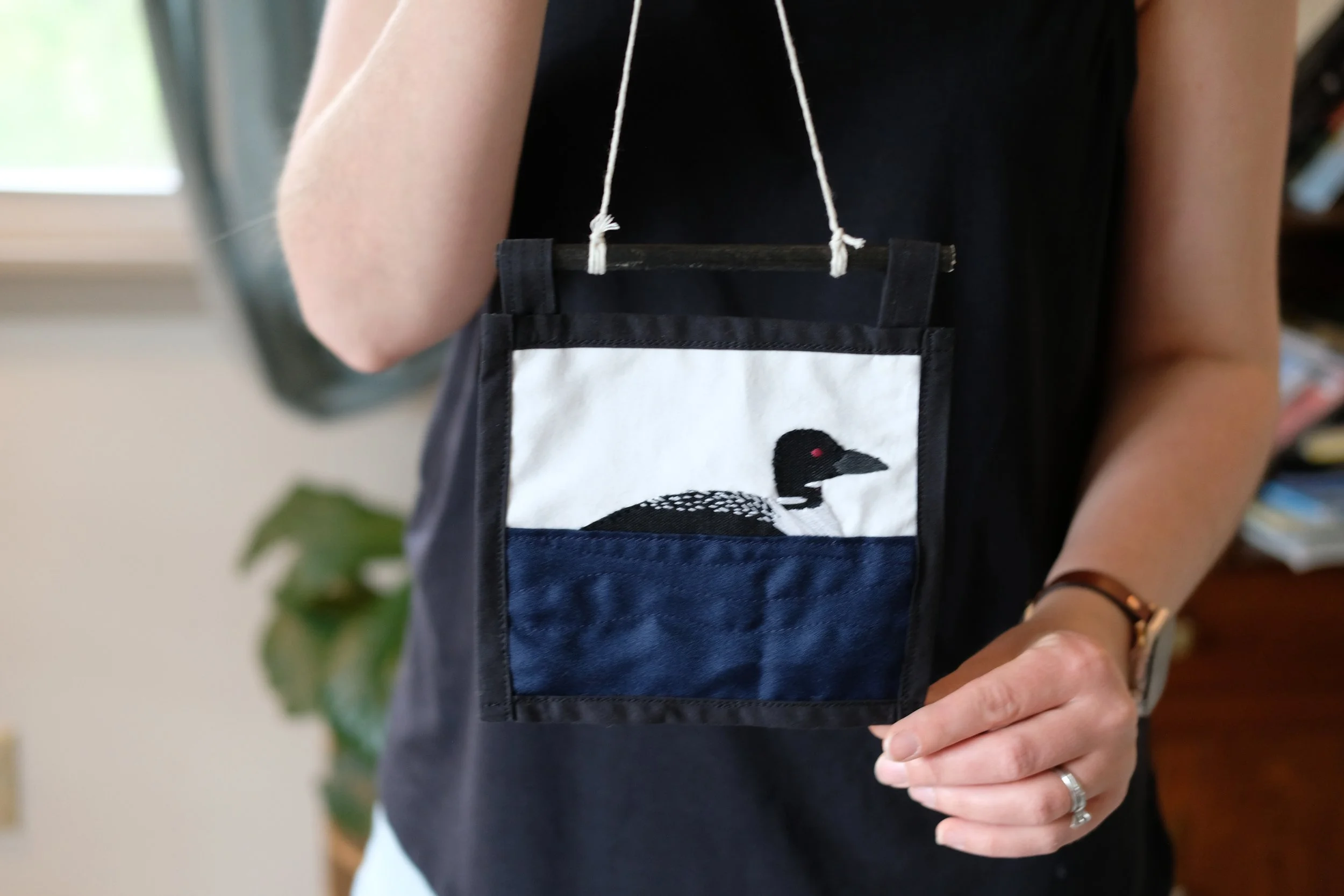 Little Loon on the Water hand-stitched embroidered wall Art. 